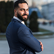 Executive client with arms crossed reviewing Optival Media's performance marketing results